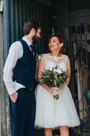 Newlyweds share a laugh after their wedding