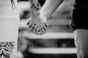 An engagement ring sitting on the bride-to-be's finger