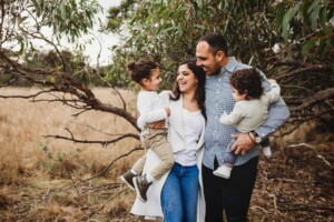 A family share a laugh during their photography session