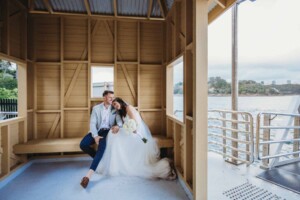Wedding portrait of a bride and groom hugging after their ceremony