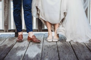 Wedding portrait of newlywed's shoes after their rainy wedding