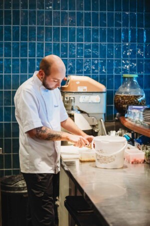 A chef preparing meals for guests at the wedding reception