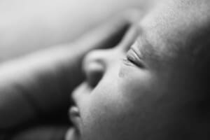 Details in black and white showing a newborn baby's eyelashes