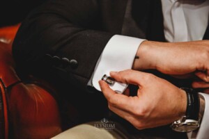 Gledswood Wedding - Detail photograph of a groom adjusting his cufflink