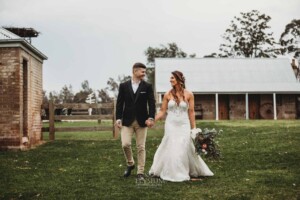 Gledswood Wedding - A bride and groom, holding hands as they walk, after their Gledswood wedding ceremony