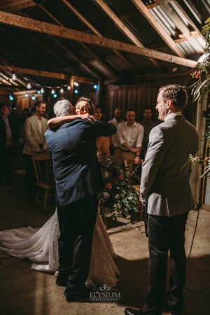 Gledswood Wedding - A bride hugs her father before the wedding ceremony at Gledswood estate