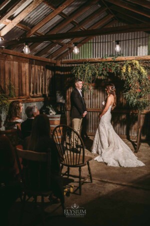 Gledswood Wedding - A bride and groom stand in front of guests at their wedding ceremony