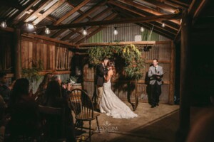 Gledswood Wedding - A bride and groom share their first kiss as husband and wife during the ceremony
