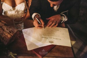 Gledswood Wedding - A bride and groom sign the marriage certificate after the ceremony