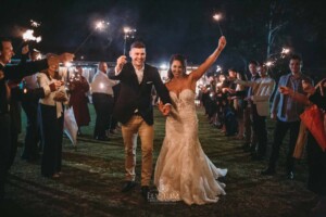 Gledswood Wedding - A bride and groom enjoy their sparkler exit after their wedding ceremony