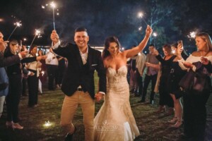 Gledswood Wedding - A bride and groom enjoy their sparkler exit after their wedding ceremony