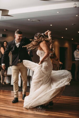 Gledswood Wedding - Gledswood Wedding - A groom twirls his bride as they enter their Gledswood wedding reception