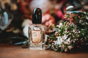 Gledswood Wedding - brides perfum sits amongst her bouquet of flowers