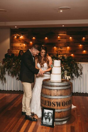 Gledswood Wedding - Bride and groom cut their wedding cake during their Gledswood reception