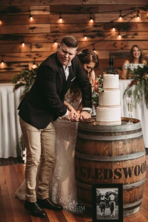 Gledswood Wedding - Bride and groom cut their wedding cake during their Gledswood reception
