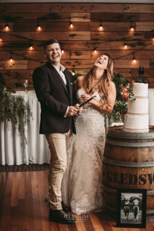Gledswood Wedding - Bride and groom cut their wedding cake during their Gledswood reception