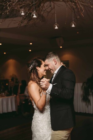 Gledswood Wedding - Bride and groom share their first dance during the wedding reception