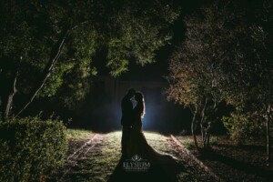 Gledswood Wedding - Backlit night photograph of a bride and groom after their Gledswood estate wedding