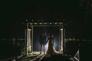 Gledswood Wedding - Backlit night photograph of a bride and groom after their Gledswood estate wedding