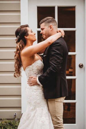 Gledswood Wedding - A bride and groom hug during their first look before the wedding ceremony at Gledswood