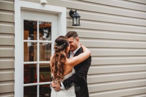 Gledswood Wedding - A bride and groom hug during their first look before the wedding ceremony at Gledswood