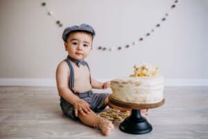 Baby boy enjoying his cake smash session in Ingleburn studio