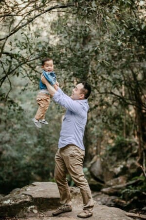 Family Session - a father lifts his little boy above him