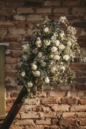Gledswood Wedding - floral details attached to the ceremony arch