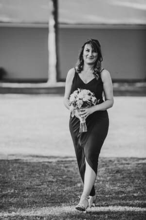 Gledswood Wedding - bridesmaid walks down the aisle to the ceremony