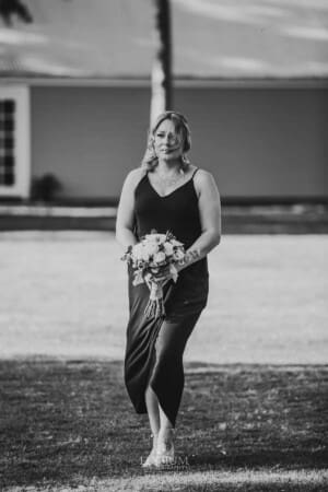 Gledswood Wedding - bridesmaid walks down the aisle to the ceremony