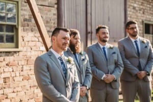 Gledswood Wedding - groom watches the bride walk down the aisle