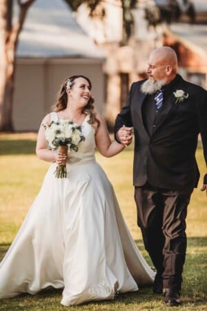 Gledswood Wedding - bride and her dad walk down the aisle to the ceremony