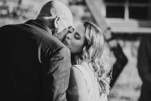 Gledswood Wedding - bride kisses her dad at the ceremony