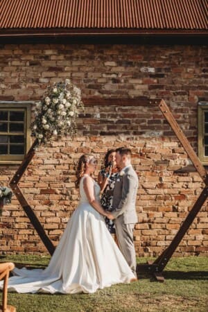 Gledswood Wedding - bride and groom stand at the front of the ceremony