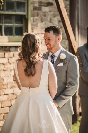Gledswood Wedding - bride and groom stand at the front of the ceremony