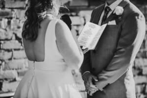 Gledswood Wedding - bride reads her vows during the ceremony