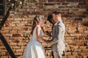 Gledswood Wedding - bride and groom giggle during the ceremony