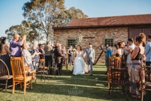 Gledswood Wedding - bride and groom walk down the aisle after the ceremony
