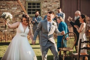 Gledswood Wedding - bride and groom walk down the aisle after the ceremony