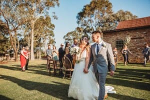 Gledswood Wedding - bride and groom walk down the aisle after the ceremony