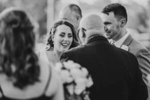 Gledswood Wedding - bride greets guests after the ceremony