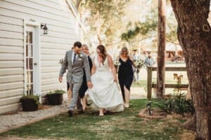 Gledswood Wedding - bridal party walks across the venue after the ceremony