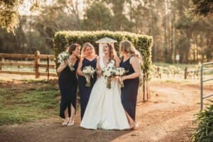 Gledswood Wedding - bridal party laughs together at sunset