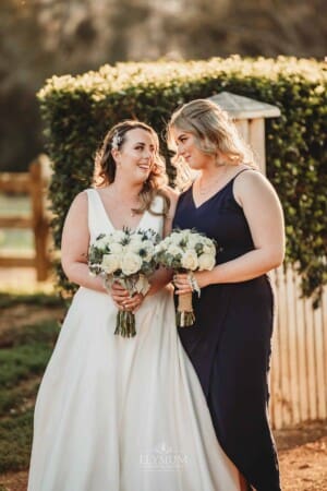 Gledswood Wedding - bridal laughs with her bridesmaid
