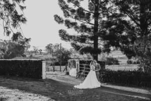 Gledswood Wedding - bride and groom stand in the venue driveway