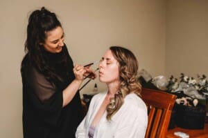 Gledswood Wedding - bride gets her make-up done before the ceremony