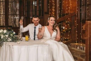 Gledswood wedding - bride and groom make a toast to the speeches