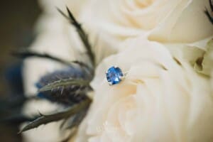 Gledswood Wedding - brides engagement ring set in her bouquet