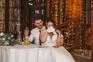 Gledswood wedding - bride wipes away a tear during the speeches