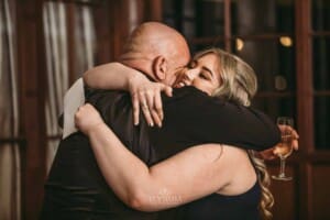 Gledswood wedding - bridesmaid hugs her dad after his speech